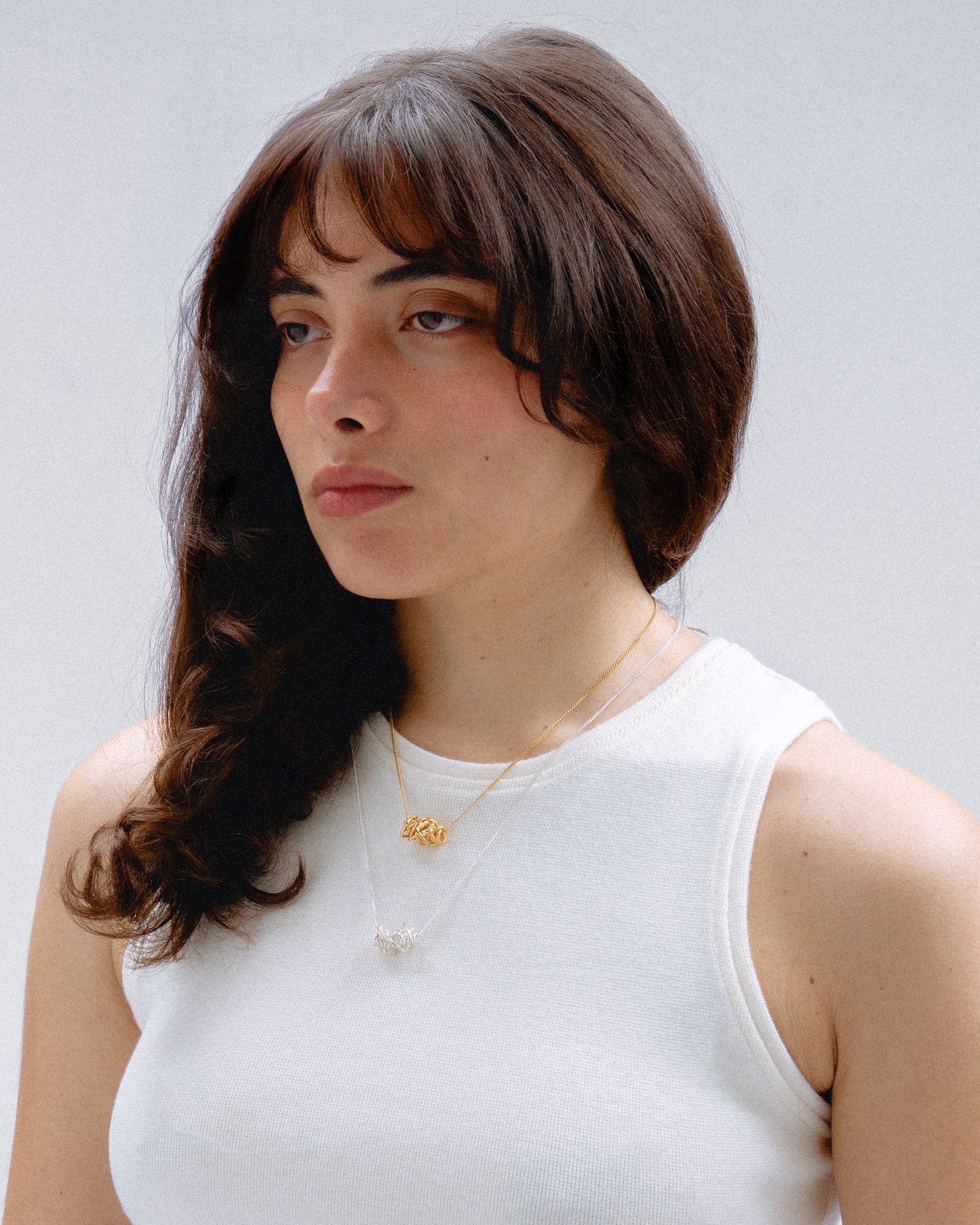 Collares de plata y dorado Embolic, hecho a mano en València
